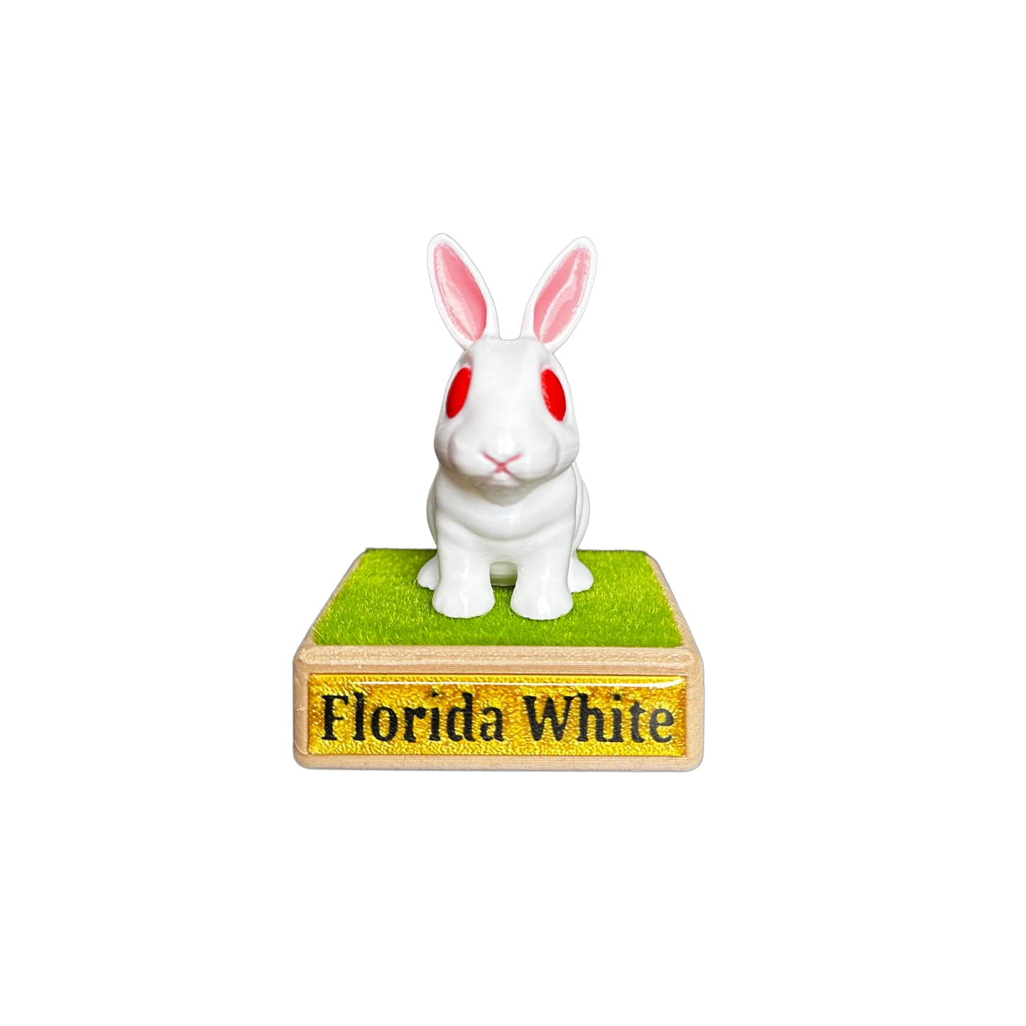 White rabbit figurine on a green base with 'Florida White' text