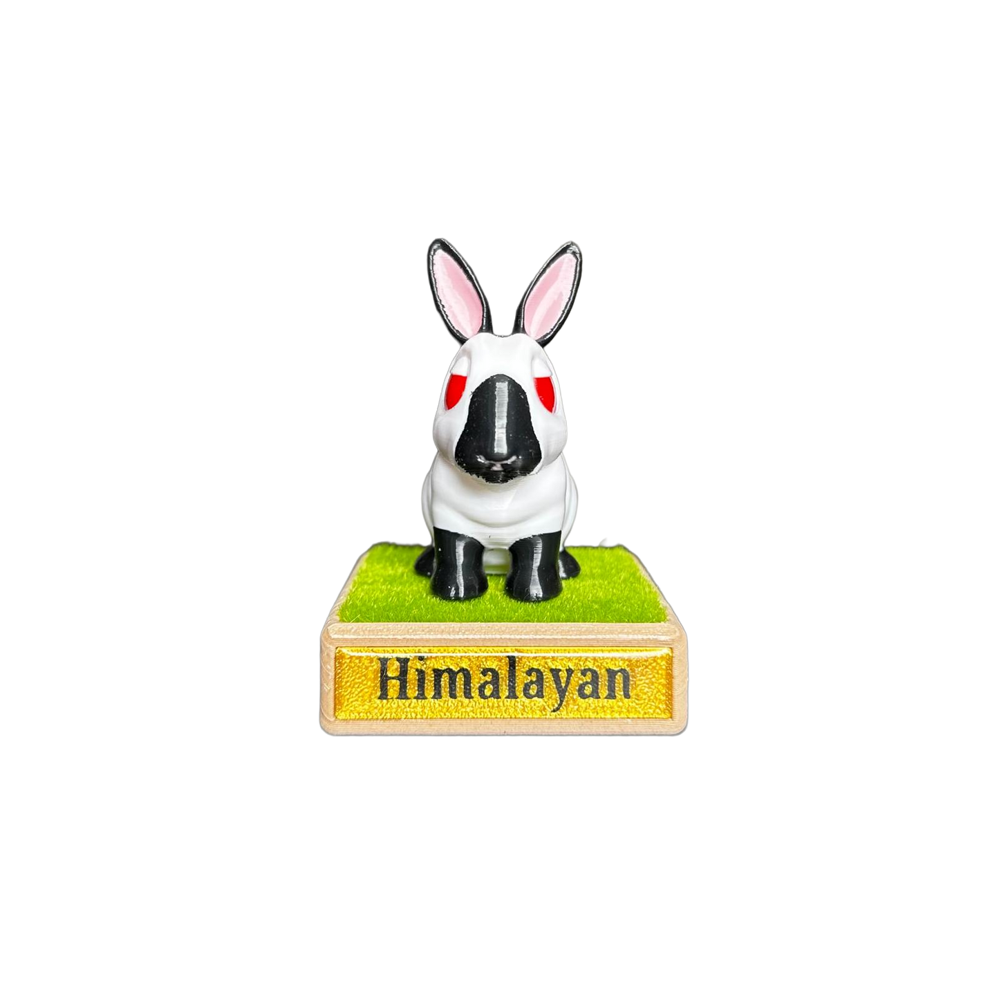 Himalayan rabbit figurine on a grass base with 'Himalayan' text