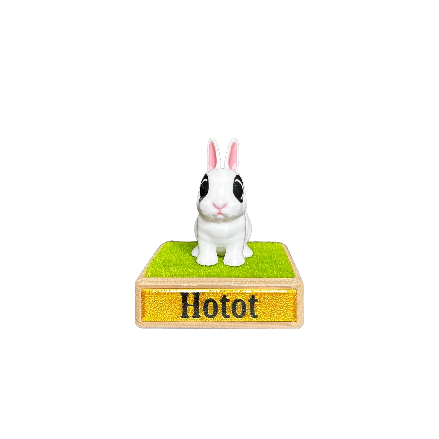 Small rabbit figurine on a stand with 'Hotot' branding 