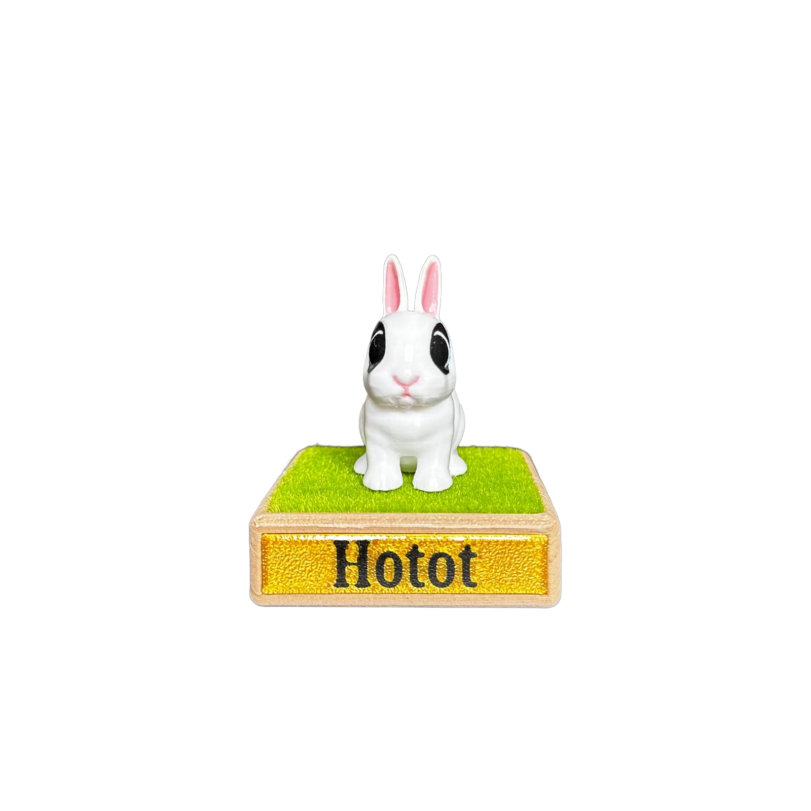 Small rabbit figurine on a stand with 'Hotot' branding 