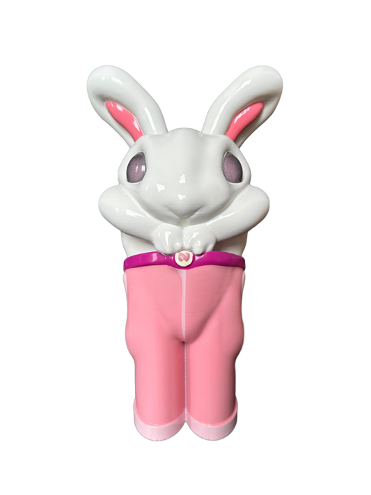 Sculpture of a white rabbit with pink pants and pink eyes